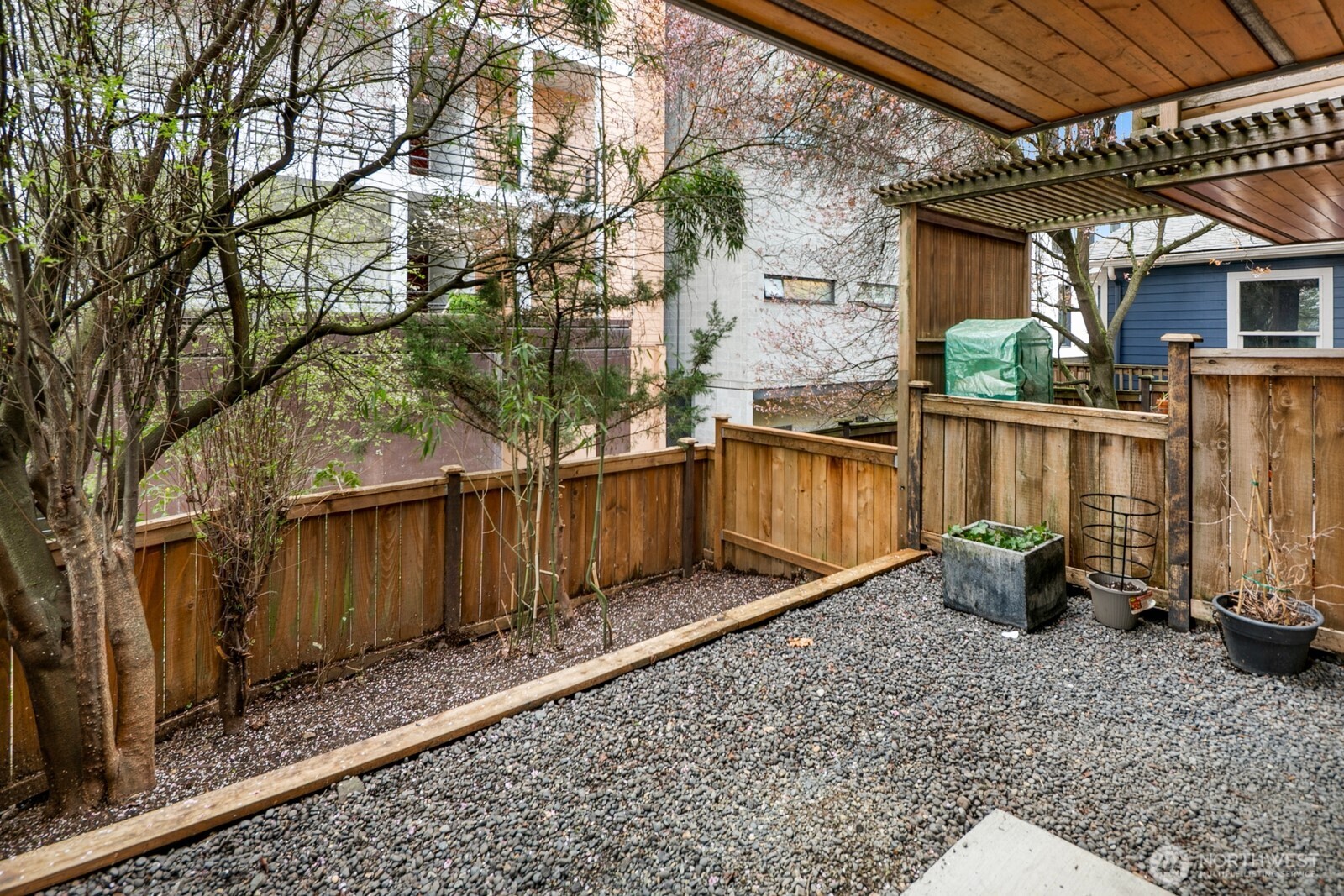 921 North 35th Street, Unit B Seattle, WA 98103 - Photo 24 of 28 a view of a backyard with potted plants