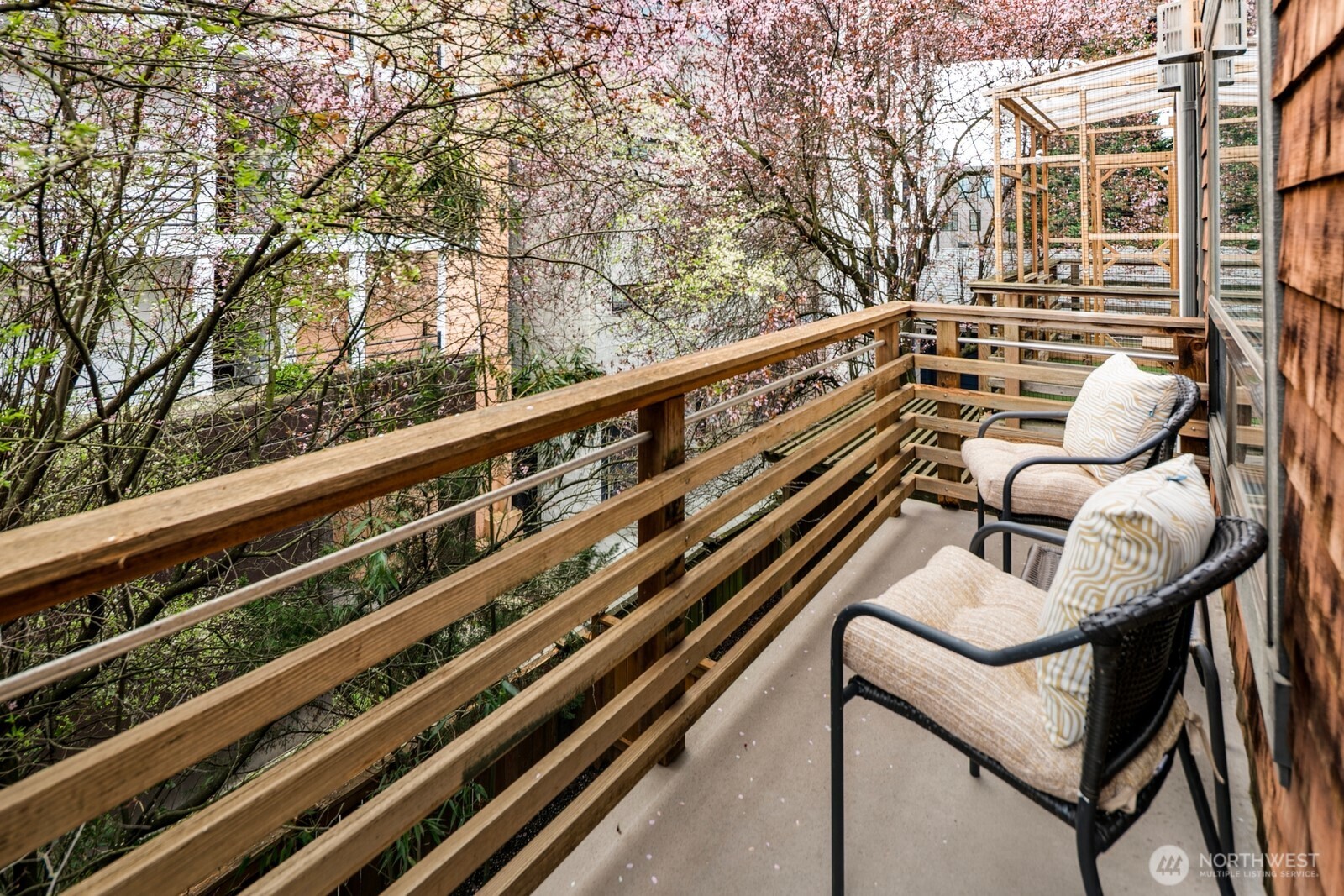 921 North 35th Street, Unit B Seattle, WA 98103 - Photo 25 of 28 a balcony with wooden floor