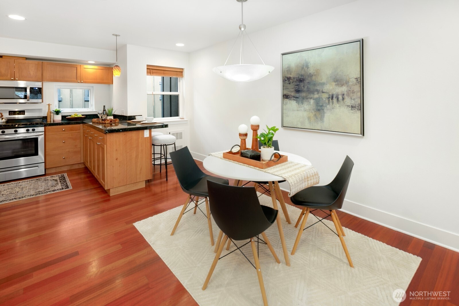 921 North 35th Street, Unit B Seattle, WA 98103 - Photo 6 of 28 a view of a dining room with furniture and wooden floor