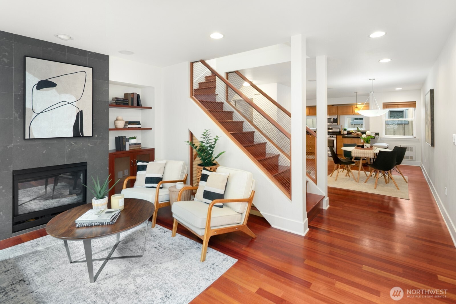 921 North 35th Street, Unit B Seattle, WA 98103 - Photo 8 of 28 a living room with fireplace furniture and a wooden floor