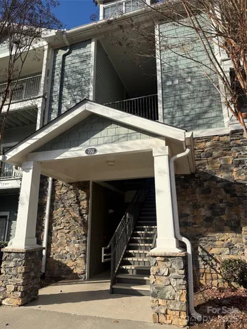 a view of backyard with small cabin