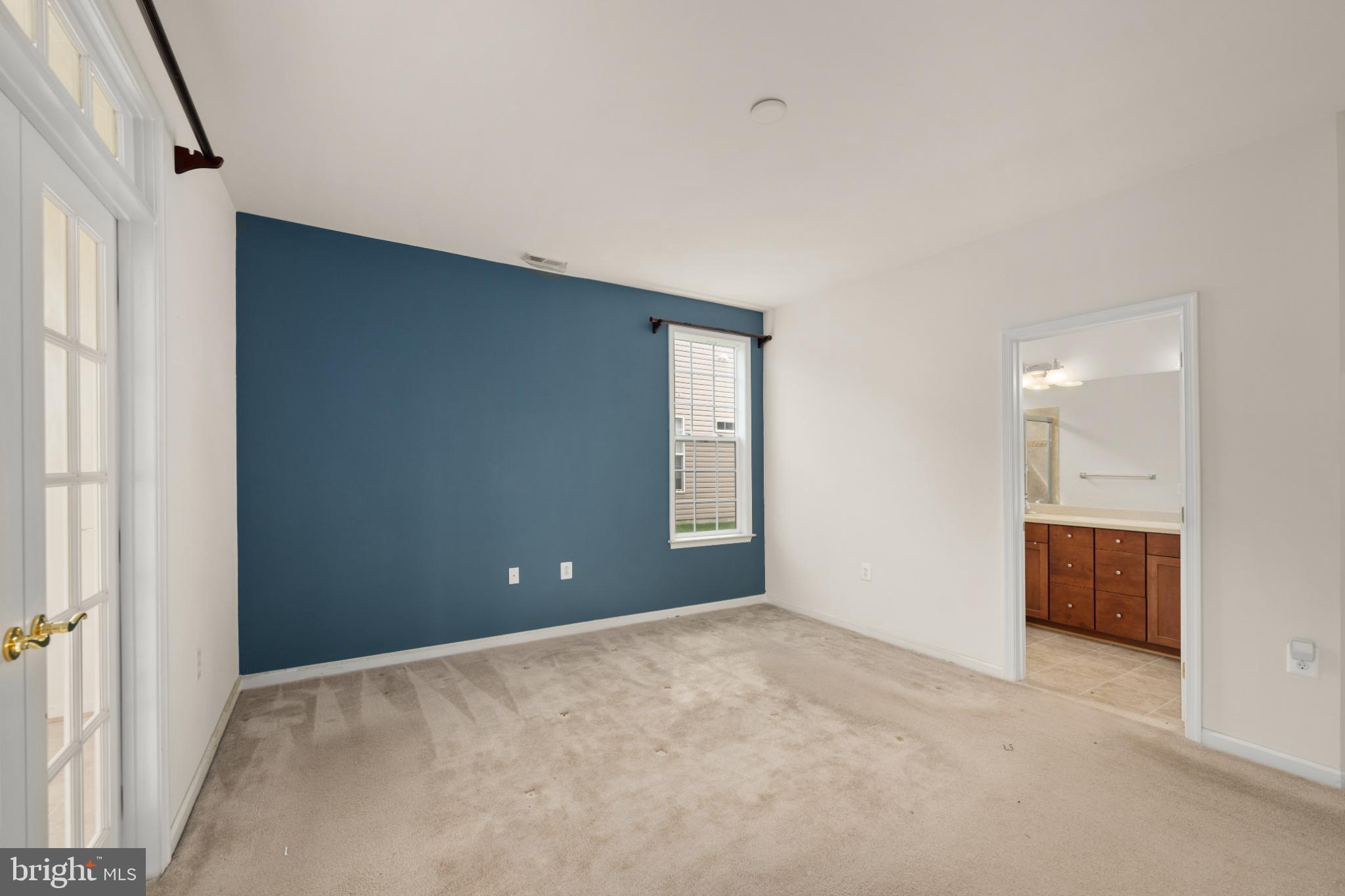 12 Harlequin Loop Bridgeville, DE 19933 - Photo 14 of 47 Spacious room with a bold accent wall.