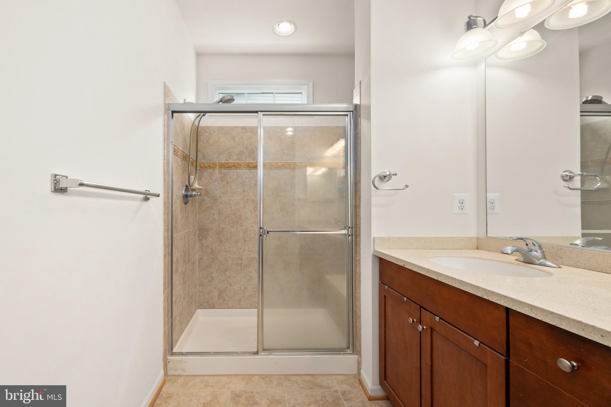 12 Harlequin Loop Bridgeville, DE 19933 - Photo 17 of 47 Modern bathroom with sleek glass shower.