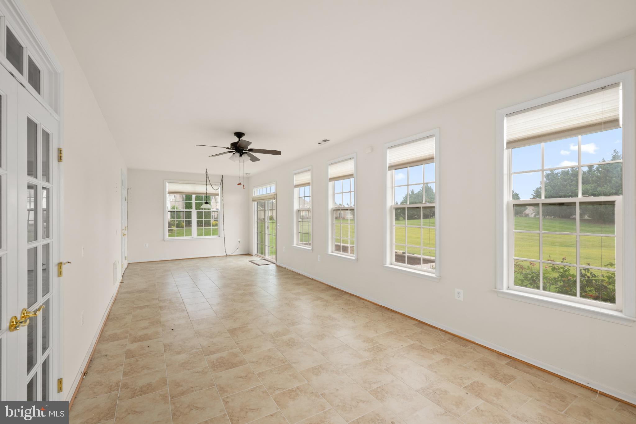 12 Harlequin Loop Bridgeville, DE 19933 - Photo 27 of 47 Bright and airy sunroom with scenic views.