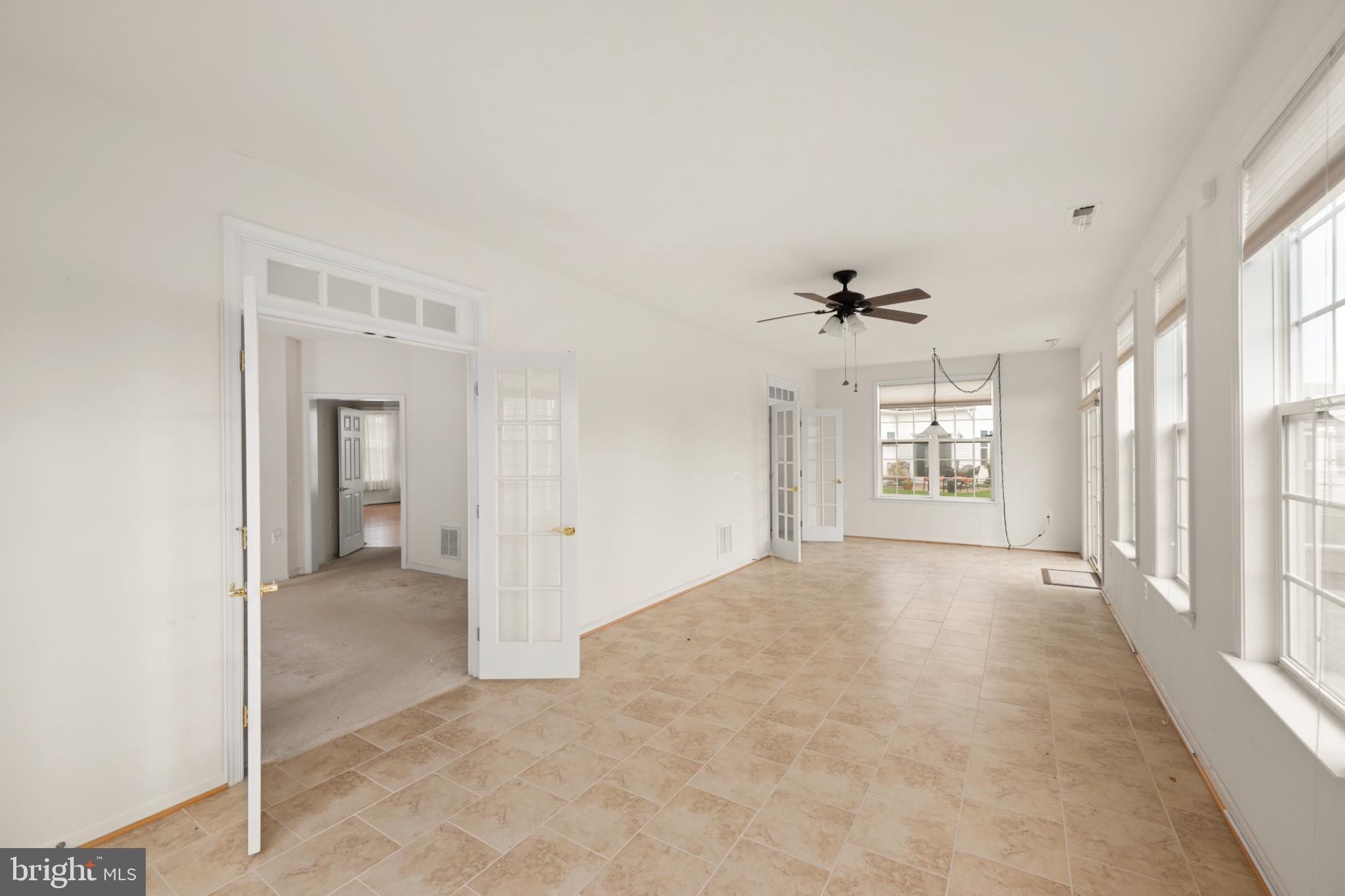 12 Harlequin Loop Bridgeville, DE 19933 - Photo 28 of 47 Spacious, sunlit living area with charm.