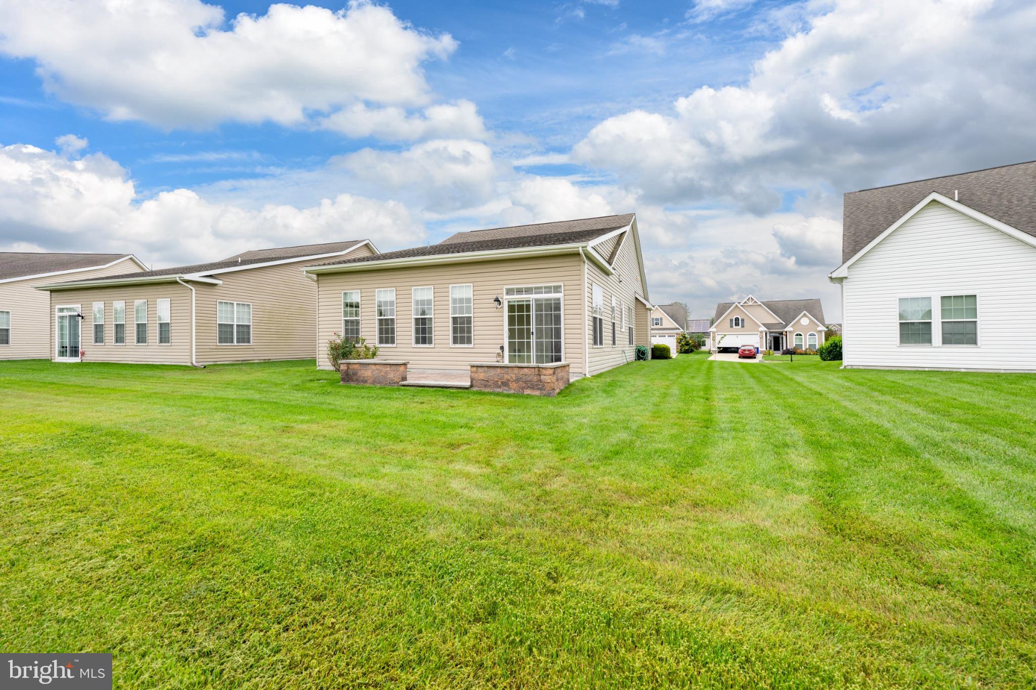 12 Harlequin Loop Bridgeville, DE 19933 - Photo 32 of 47 Charming homes amidst lush green lawns.