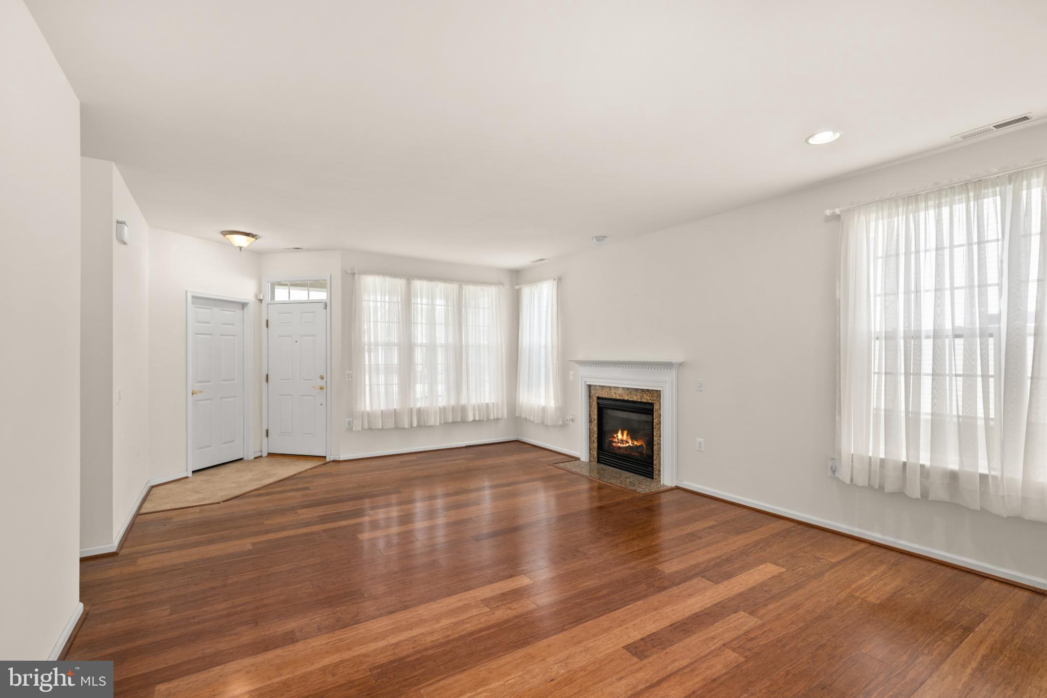 12 Harlequin Loop Bridgeville, DE 19933 - Photo 4 of 47 Bright and inviting living space with warmth.