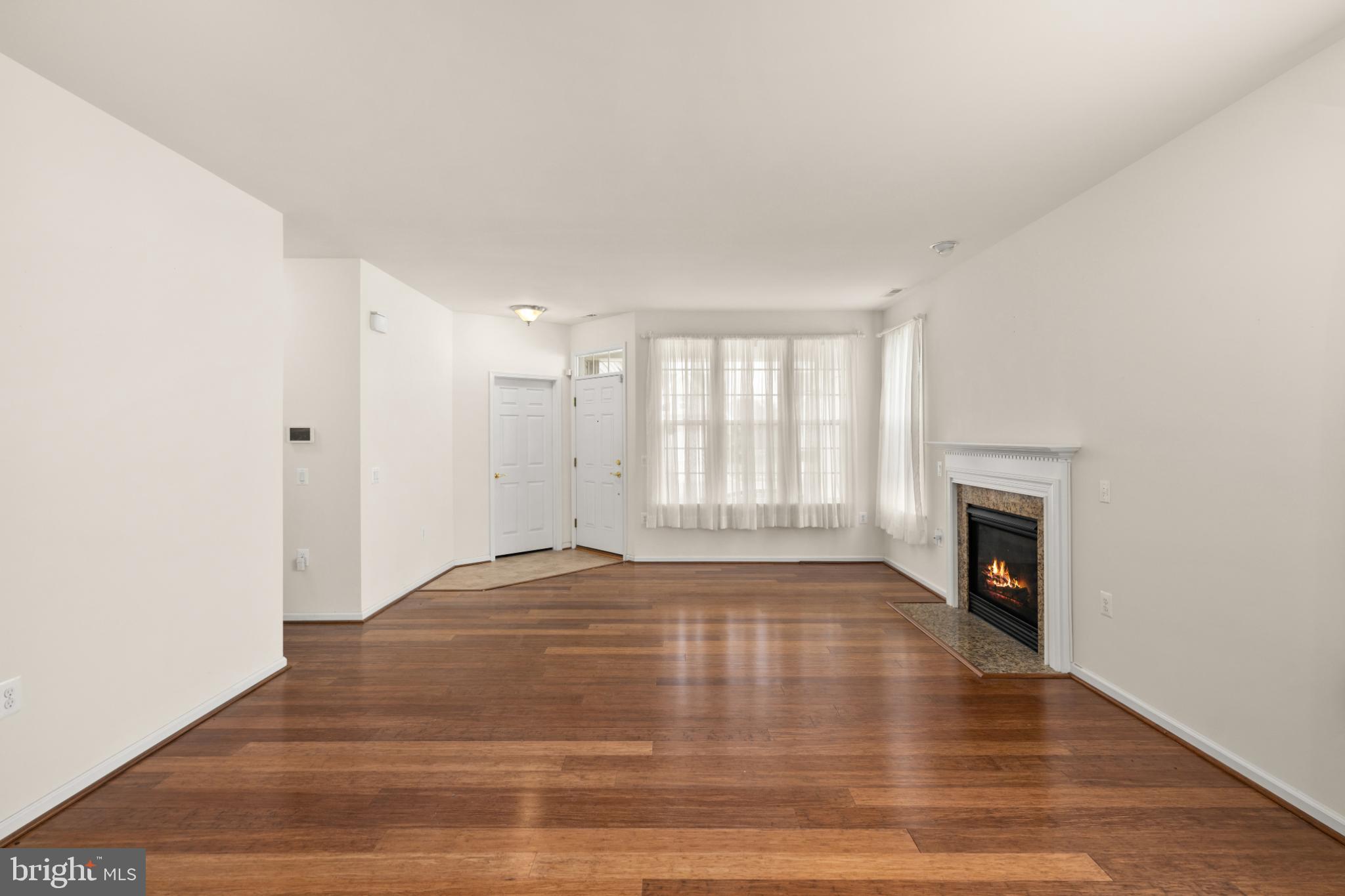 12 Harlequin Loop Bridgeville, DE 19933 - Photo 5 of 47 Spacious living area with inviting fireplace.