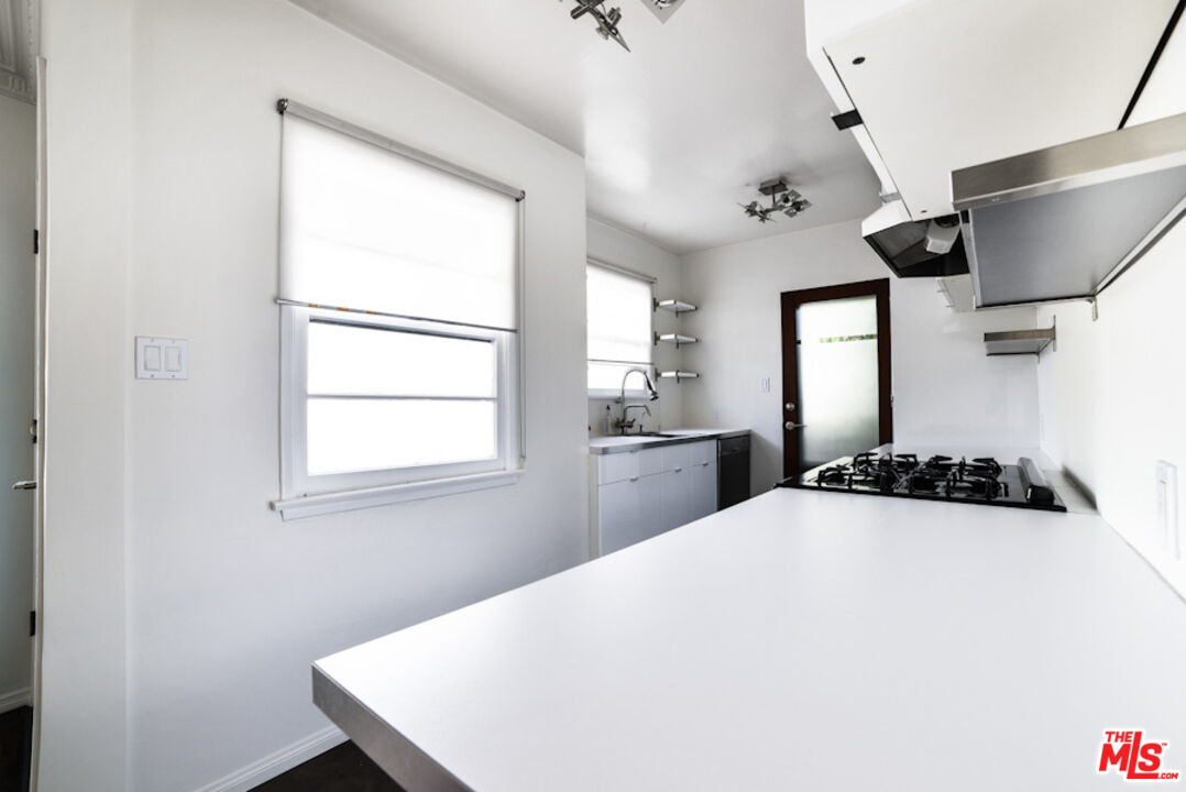 218 Venice Way Venice, CA 90291 - Photo 14 of 17 a kitchen with stainless steel appliances a sink a window and cabinets