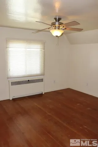 a view of an empty room with glass door