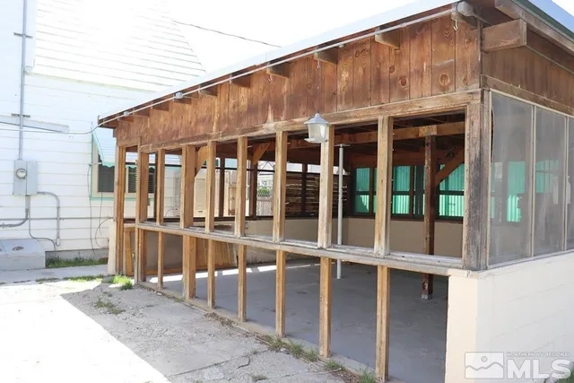 a front view of a house with a large window