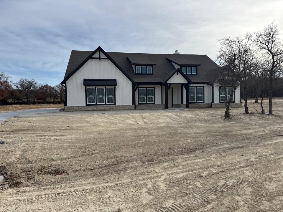 View of front of house with board and batten siding