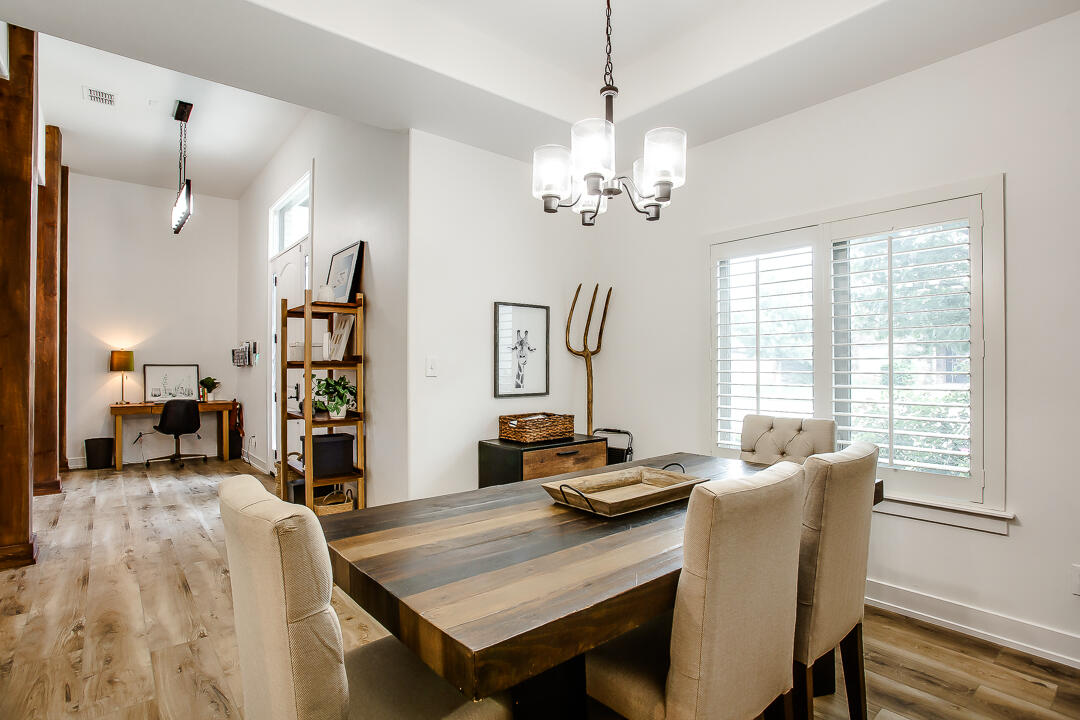 4106 124th Street Lubbock, TX 79423 - Photo 11 of 30 a view of a dining room with furniture window and wooden floor