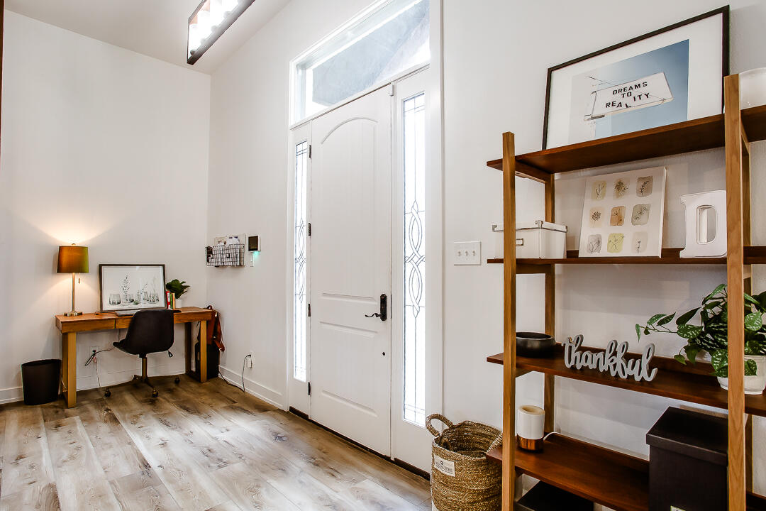 4106 124th Street Lubbock, TX 79423 - Photo 12 of 30 a view of a room with gym equipment and wooden floor