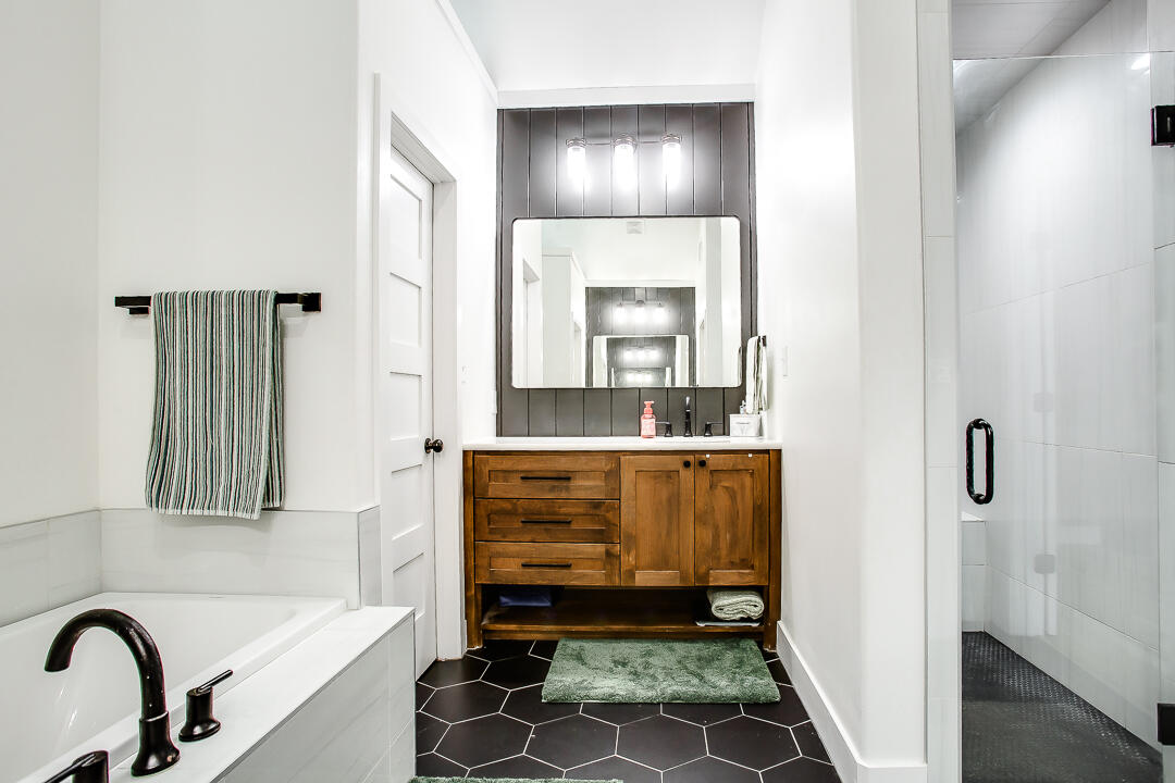 4106 124th Street Lubbock, TX 79423 - Photo 15 of 30 a bathroom with a bathtub and a sink