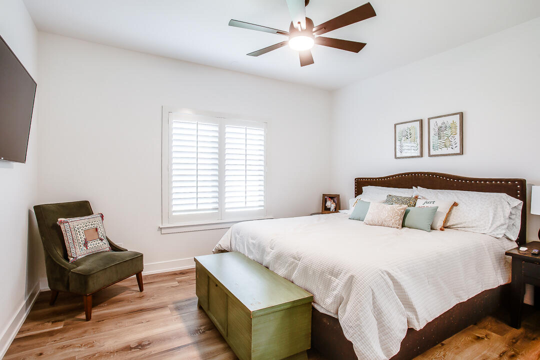 4106 124th Street Lubbock, TX 79423 - Photo 17 of 30 a bedroom with a bed and a couch
