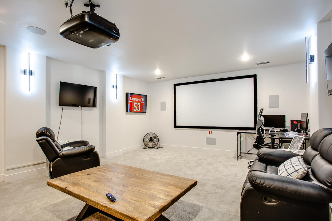 4106 124th Street Lubbock, TX 79423 - Photo 18 of 30 a living room with furniture and a flat screen tv
