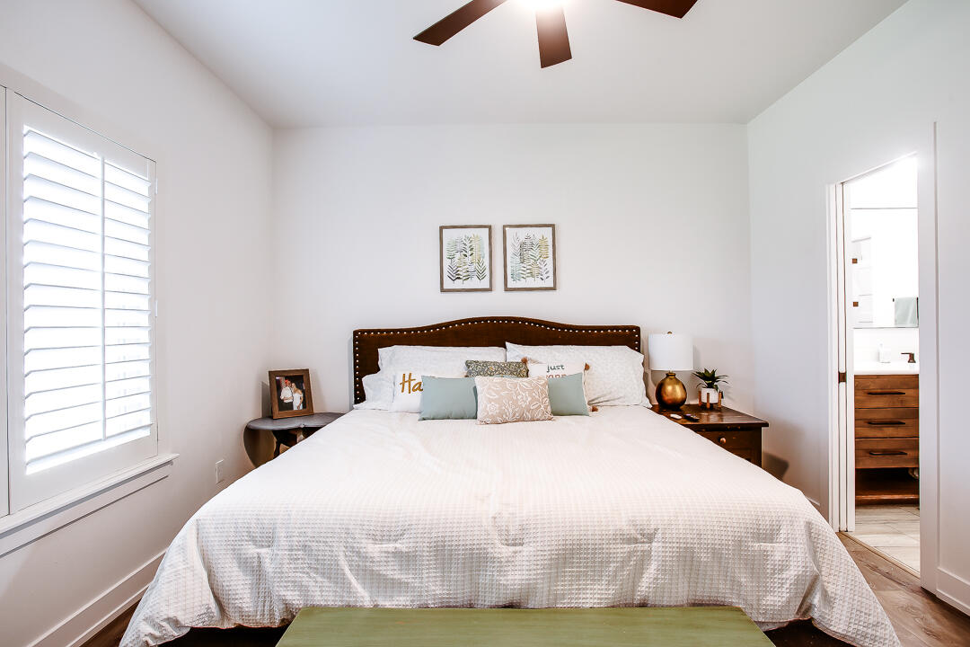 4106 124th Street Lubbock, TX 79423 - Photo 19 of 30 a bedroom with a bed and a window
