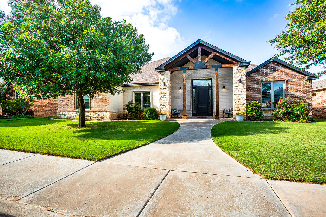 4106 124th Street Lubbock, TX 79423 - Photo 2 of 30 a front view of a house with a yard
