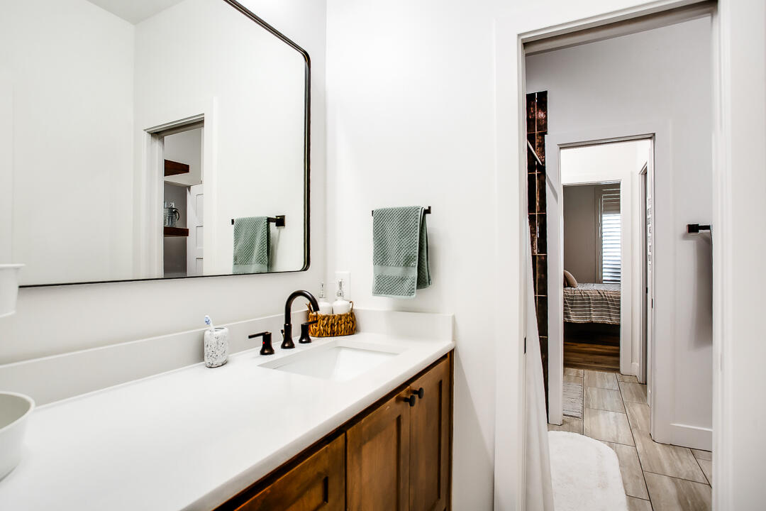 4106 124th Street Lubbock, TX 79423 - Photo 21 of 30 a bathroom with a sink and a mirror