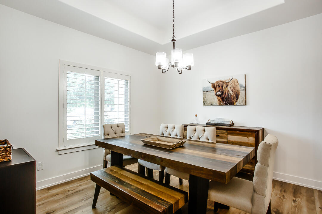 4106 124th Street Lubbock, TX 79423 - Photo 10 of 30 a view of a dining room with furniture window and wooden floor