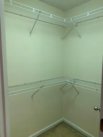 a view of a room with racks on the wall