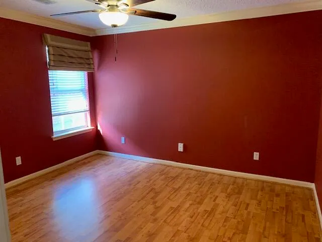 an empty room and window in a room