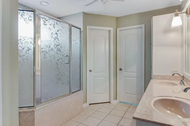 a bathroom with a sink and a shower