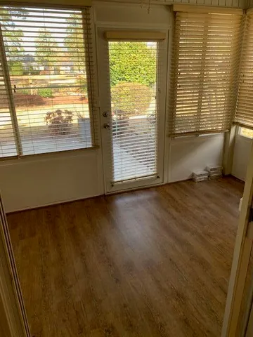 a view of an empty room with a window