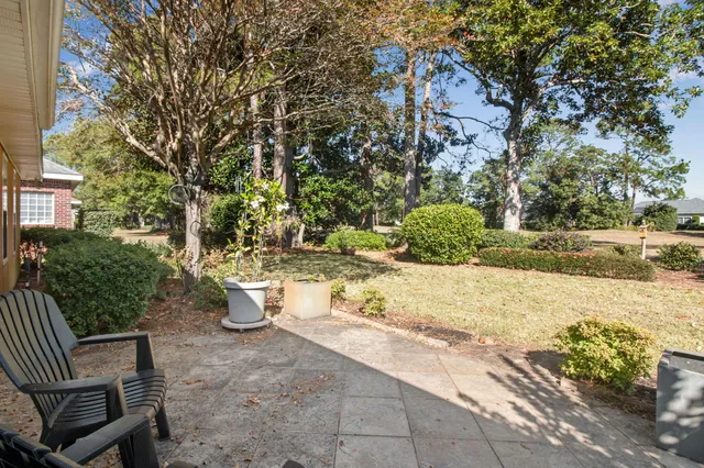 a view of a backyard of the house
