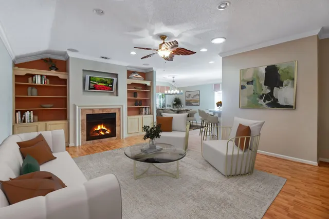 a living room with furniture and a fireplace