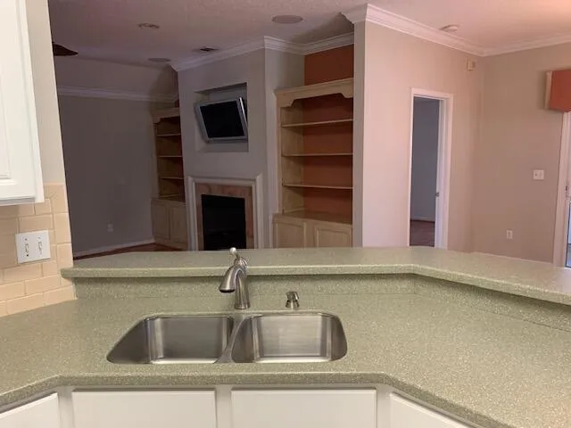 a kitchen with a sink and a window