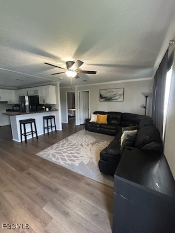 651 Hunting Club Avenue Clewiston, FL 33440 - Photo 4 of 9 a living room with furniture and a wooden floor