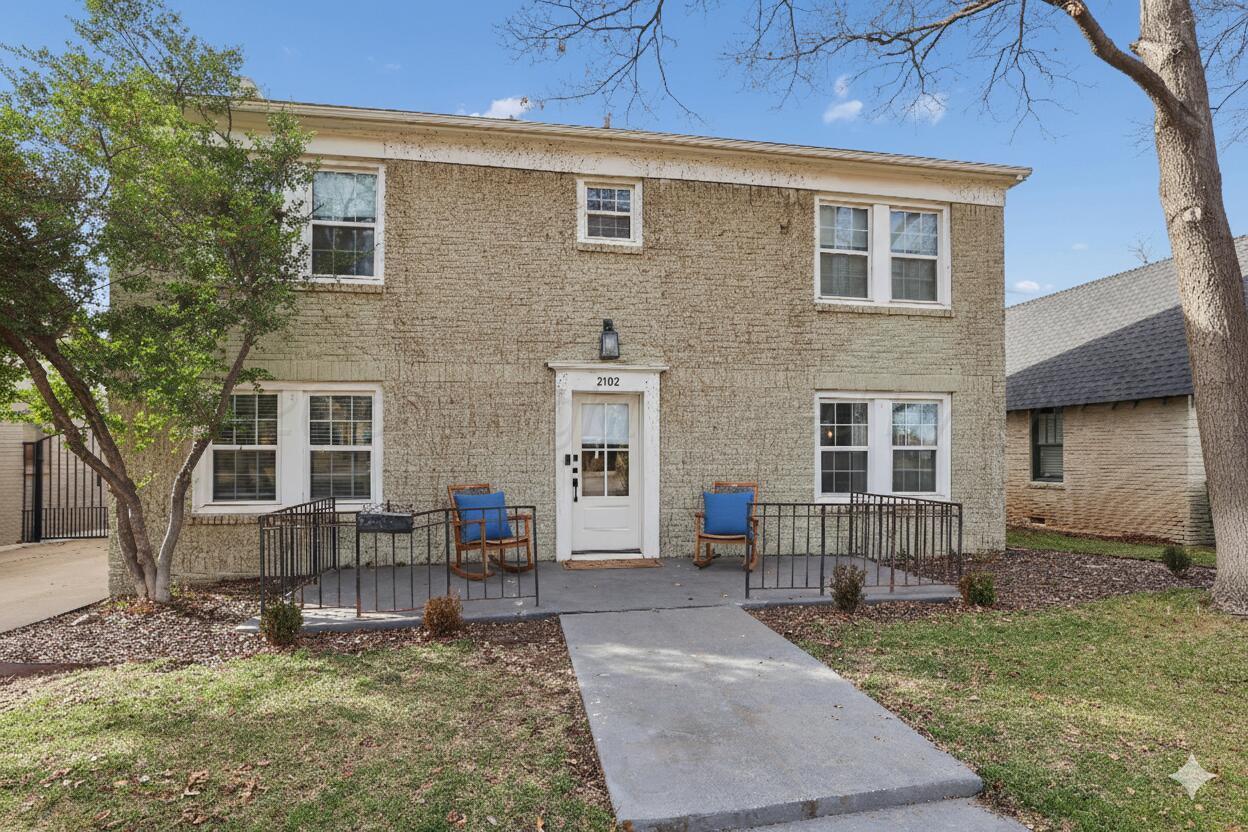 a backyard of a house with seating space