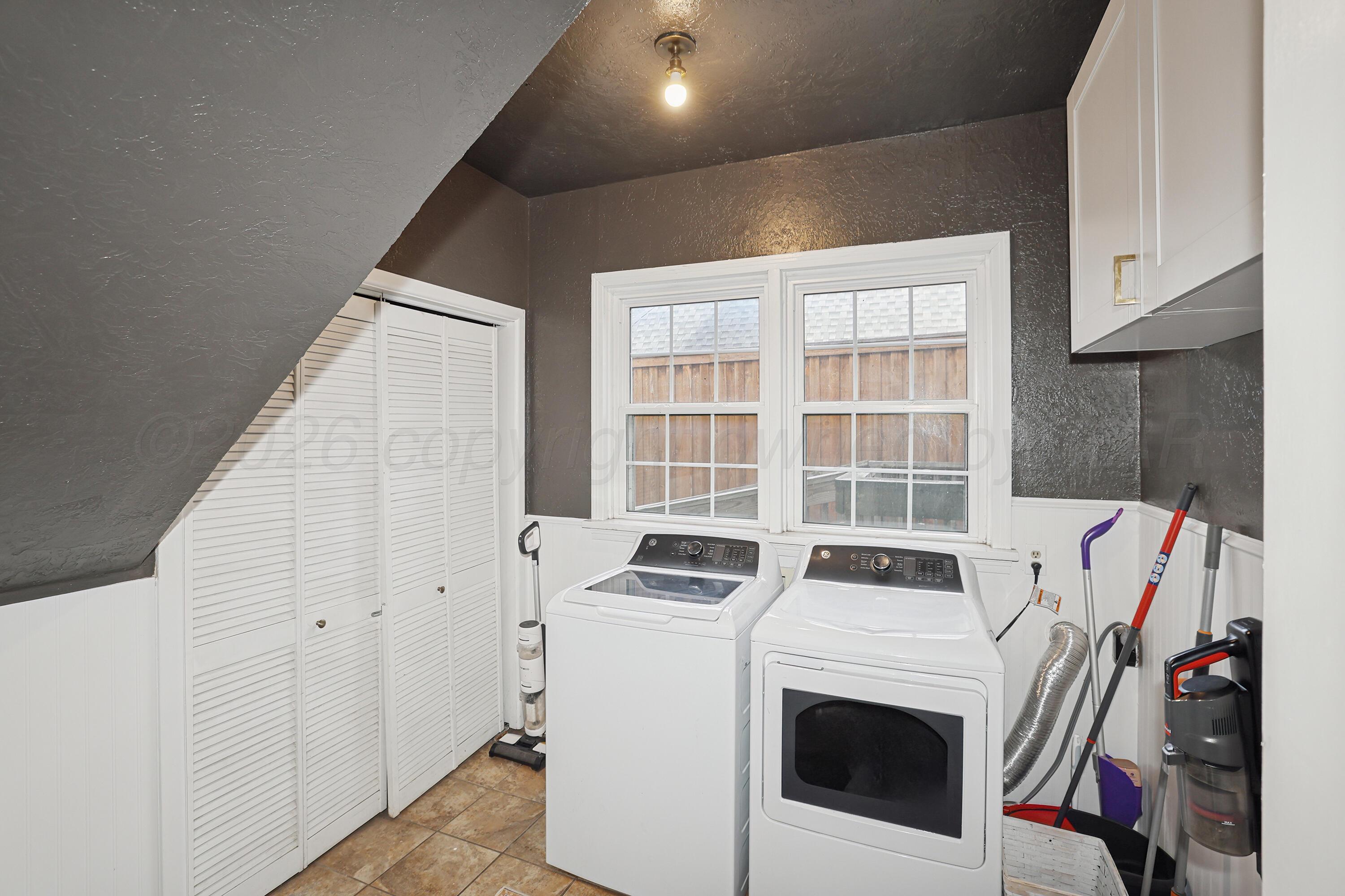 2102 South Hayden Street Amarillo, TX 79109 - Photo 16 of 37 a view of a storage and utility room with washer and dryer