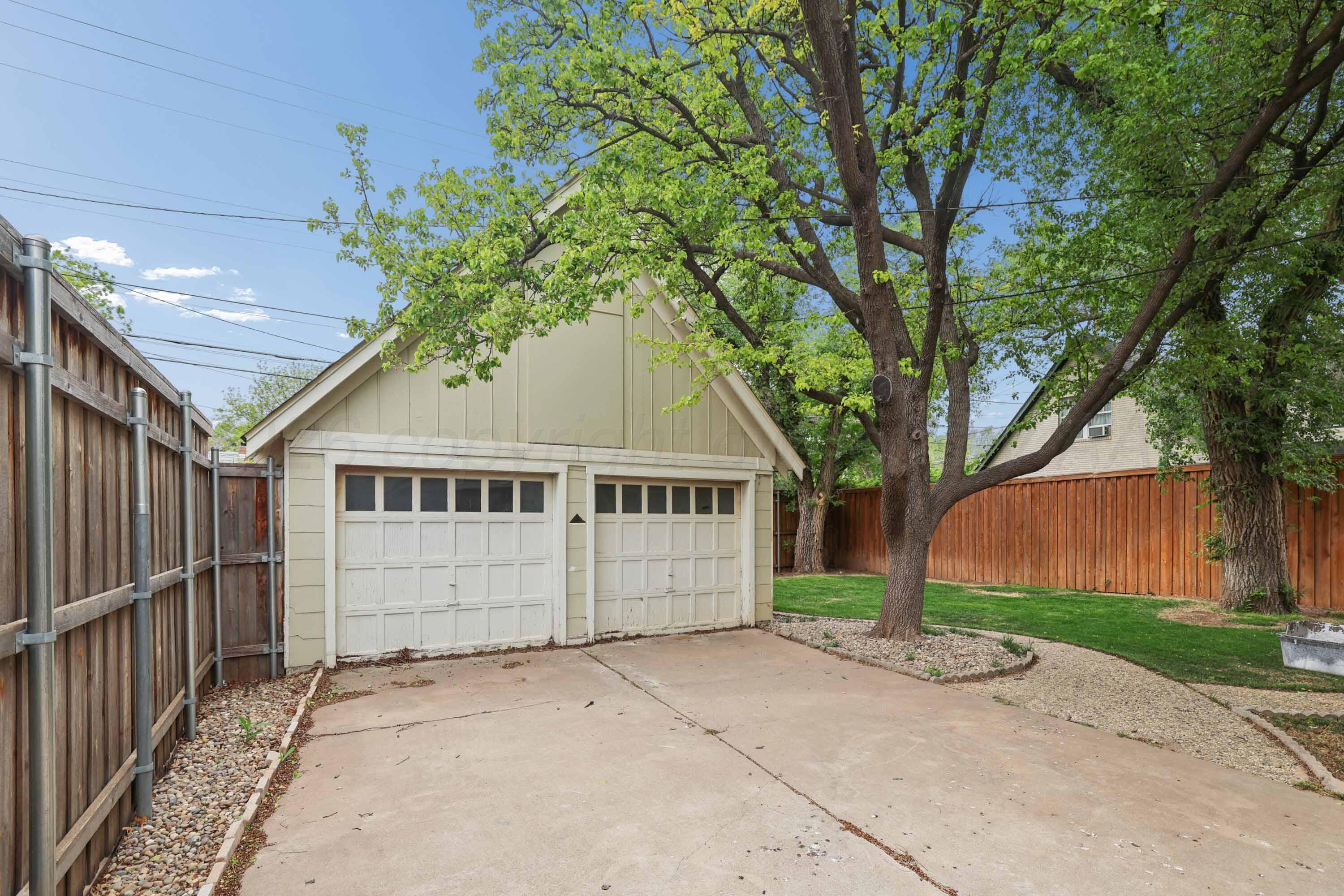 2102 South Hayden Street Amarillo, TX 79109 - Photo 36 of 37 a front view of a house with a garden