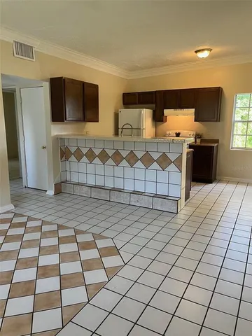a room with gym equipment and mirrors