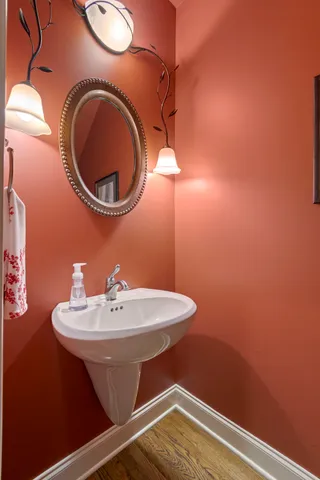 a living room with a fireplace furniture a flat screen tv and a fireplace