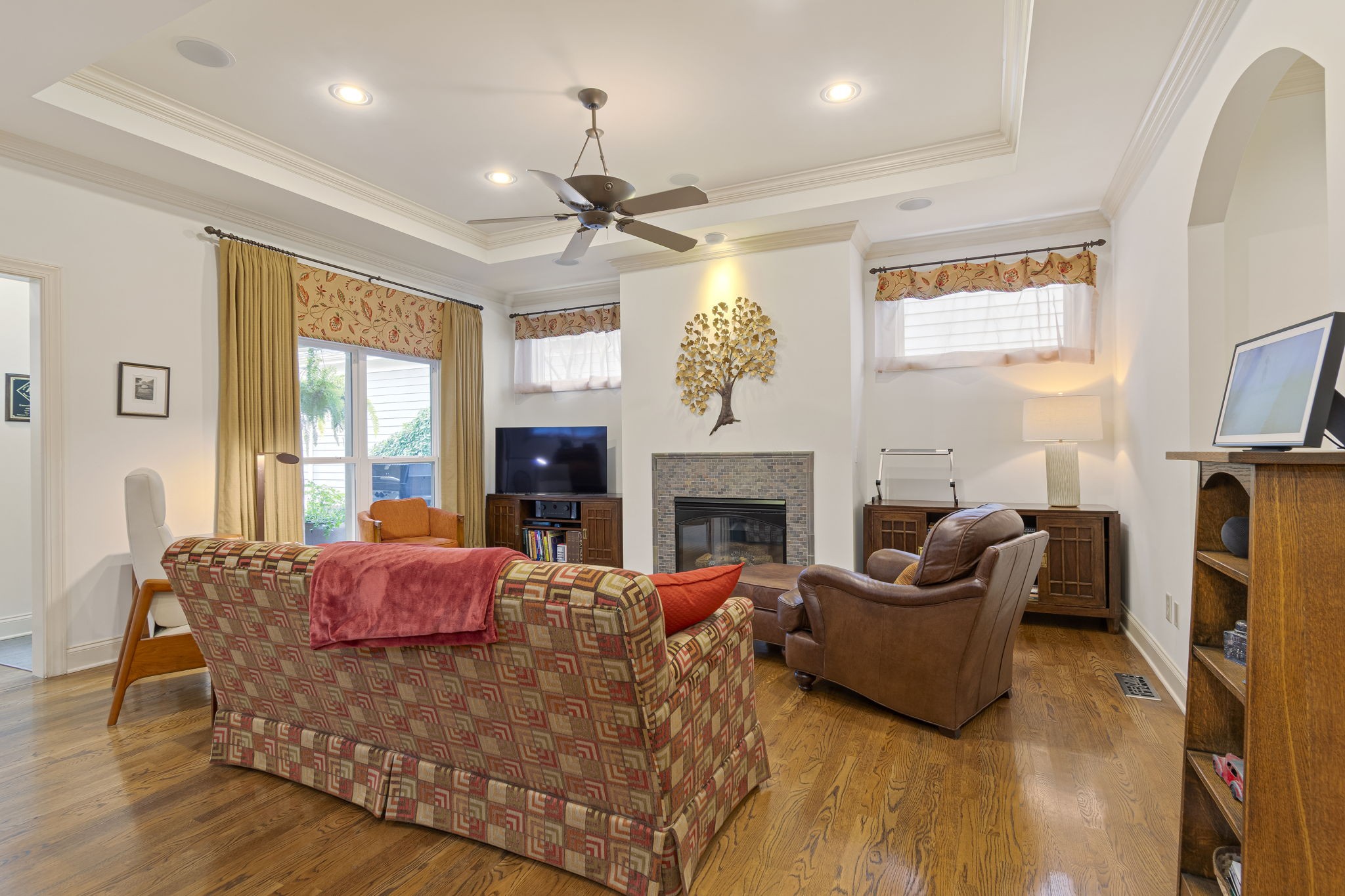 713 Pearre Springs Way Franklin, TN 37064 - Photo 21 of 95 a living room with furniture a fireplace and a flat screen tv