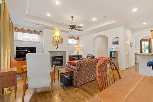 a kitchen with stainless steel appliances kitchen island granite countertop a sink and a refrigerator
