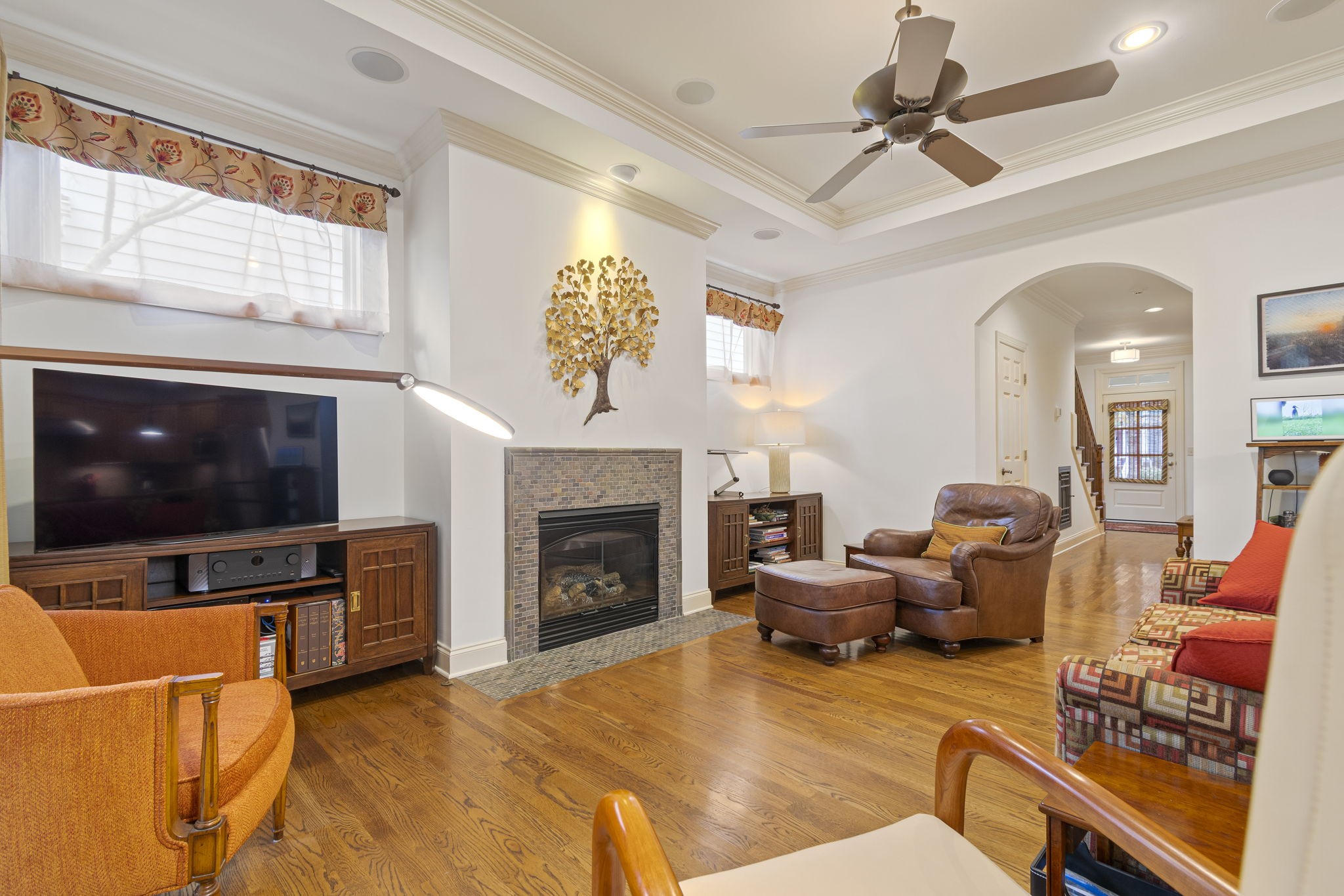713 Pearre Springs Way Franklin, TN 37064 - Photo 24 of 95 a living room with furniture a flat screen tv and a fireplace
