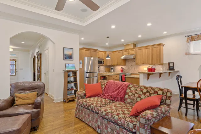 a kitchen with stainless steel appliances granite countertop a sink stove and cabinets