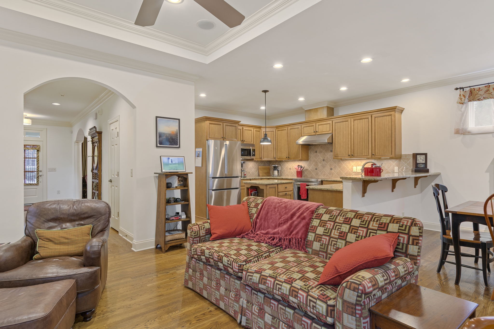 713 Pearre Springs Way Franklin, TN 37064 - Photo 28 of 95 a living room with furniture kitchen view and a wooden floor