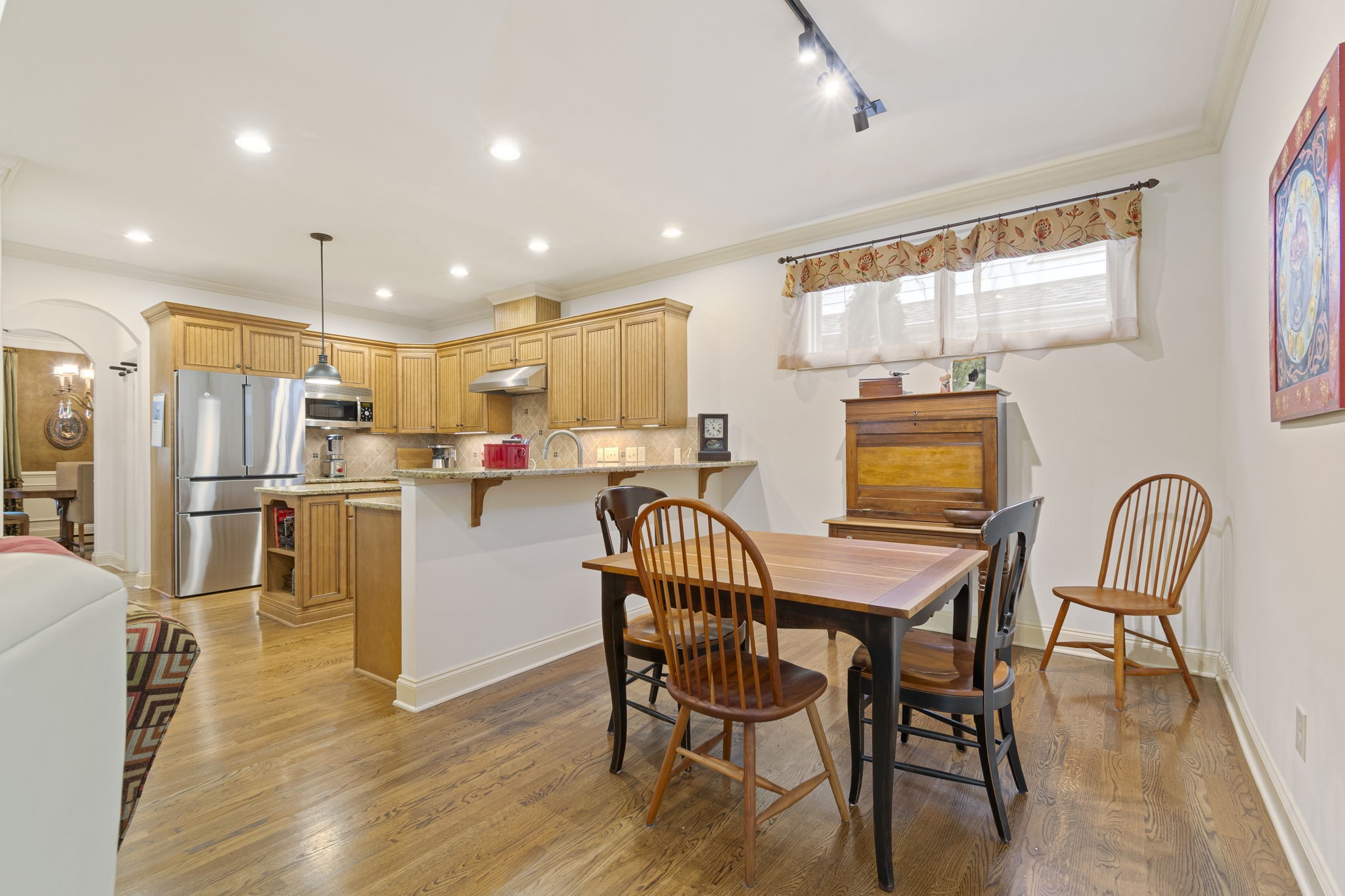 713 Pearre Springs Way Franklin, TN 37064 - Photo 31 of 95 a dining room with stainless steel appliances furniture a dining table and kitchen view