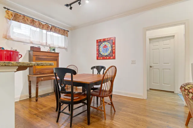 a bathroom with a tub and a painting on the wall
