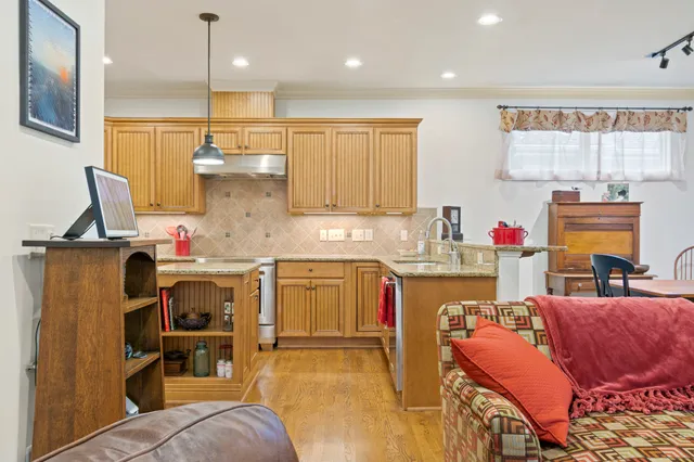 a view of a workspace with furniture and a living room
