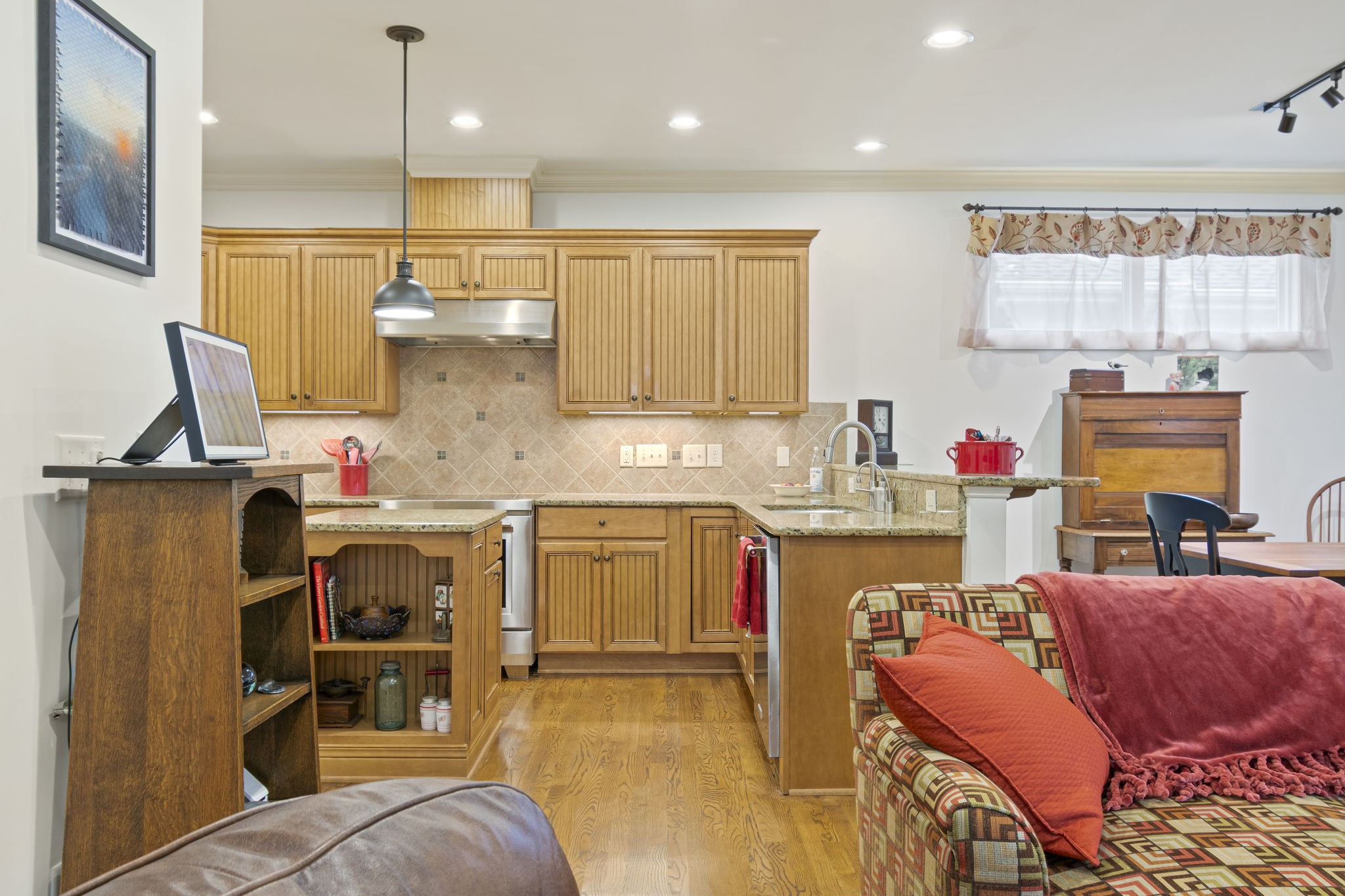 713 Pearre Springs Way Franklin, TN 37064 - Photo 35 of 95 a kitchen with stainless steel appliances kitchen island granite countertop a sink and a refrigerator
