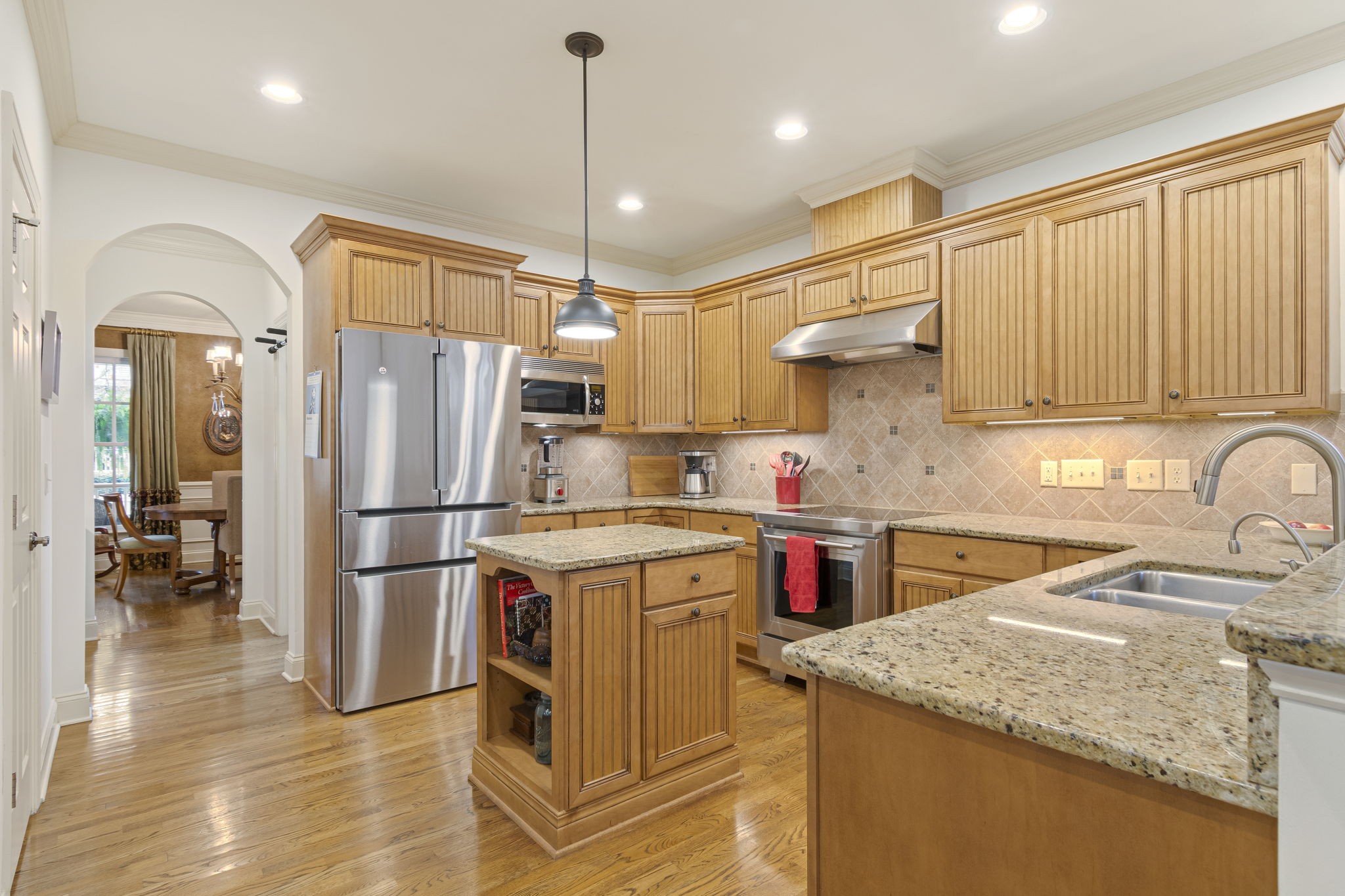 713 Pearre Springs Way Franklin, TN 37064 - Photo 36 of 95 a kitchen with a sink a refrigerator and cabinetry
