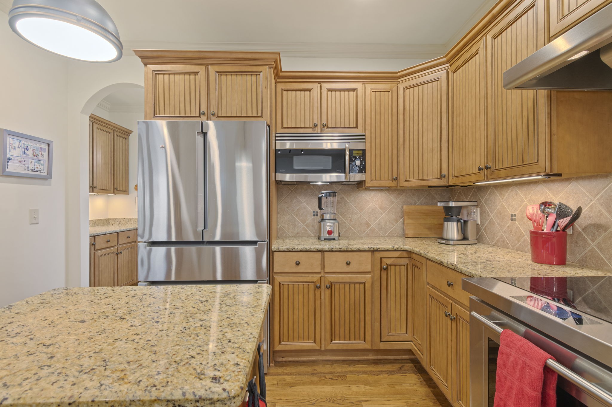 713 Pearre Springs Way Franklin, TN 37064 - Photo 37 of 95 a kitchen with stainless steel appliances granite countertop a refrigerator sink and cabinets