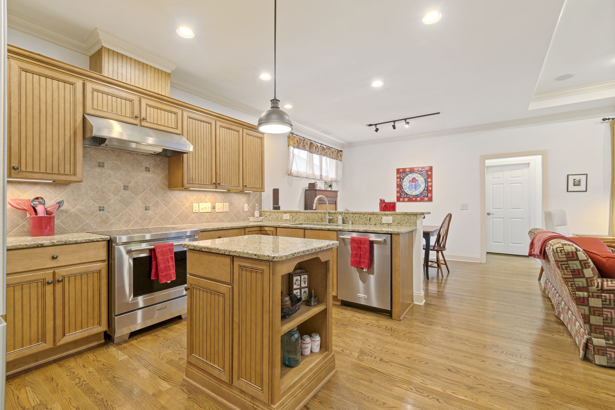 713 Pearre Springs Way Franklin, TN 37064 - Photo 38 of 95 a kitchen with stainless steel appliances granite countertop a stove and a wooden floors